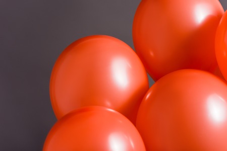 coral air balloons on grey background, color of 2019 conceptの写真素材