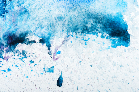 top view of blue watercolor spill on white backgroundの写真素材