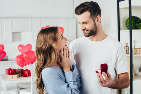 selective focus of man doing proposal at valentines day to girlfriendの写真素材