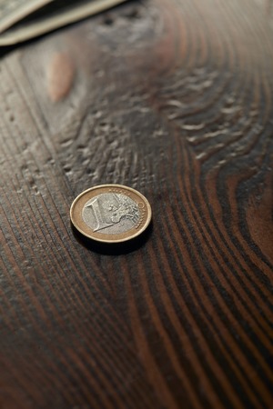 coin on wooden and brown table with copy spaceの写真素材