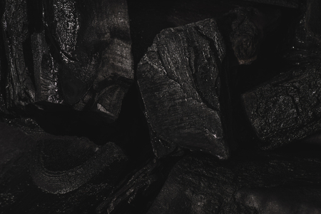 dark black background of textured charcoal with copy spaceの写真素材