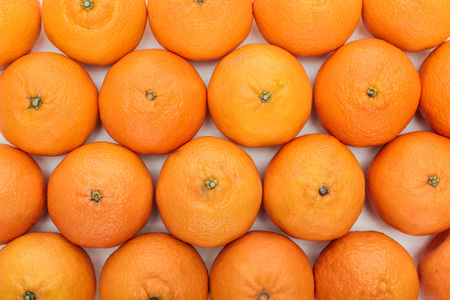 top view of whole ripe tangerines on white background