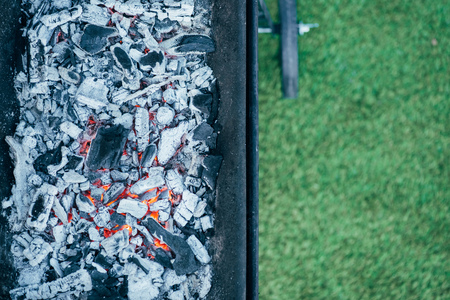 top view of barbecue with burning hot coals and ashの写真素材