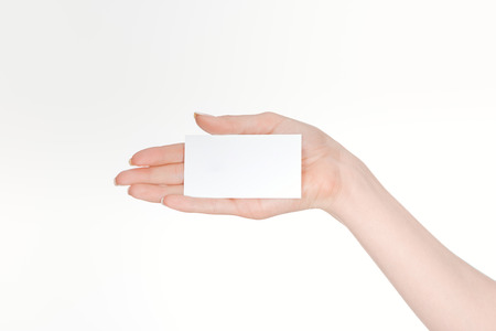 partial view of woman holding blank card isolated on whiteの写真素材