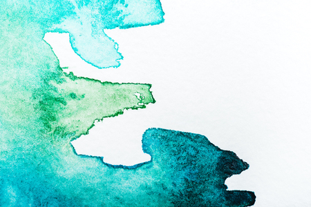 top view of turquoise watercolor spill on white backgroundの写真素材