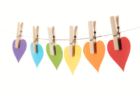 selective focus of rainbow multicolored paper hearts on rope isolated on white, lgbt conceptの写真素材