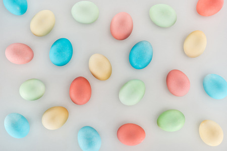 top view of background with easter eggs isolated on greyの写真素材