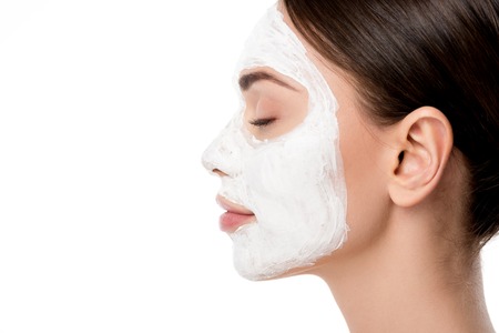 woman with facial skin care mask and eyes closed isolated on white with copy space