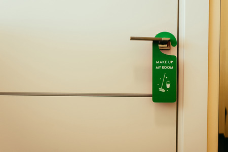 green sign with make up my room lettering on door handle, cleaning serviceの写真素材