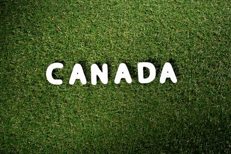 top view of word 'Canada' on green grass backgroundの写真素材