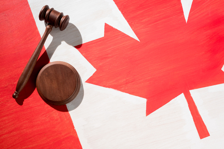 wooden gavel with canadian flag on background, justice conceptの写真素材