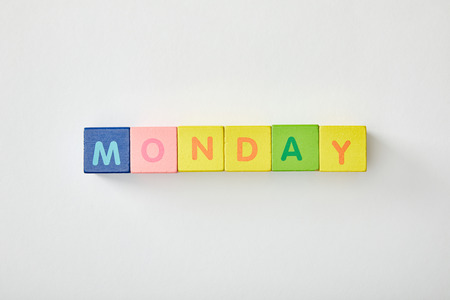 top view of monday lettering made of multicolored cubes on white backgroundの写真素材