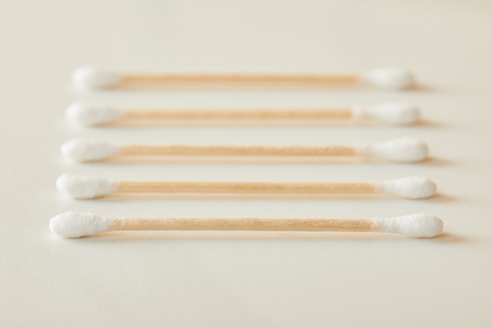 selective focus of ear sticks on white marble backgroundの写真素材