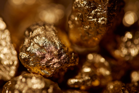 selective focus of golden stones with sparkling lights
