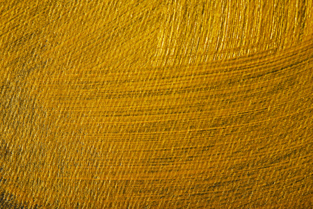 dark canvas drawn of different golden brushstrokesの写真素材