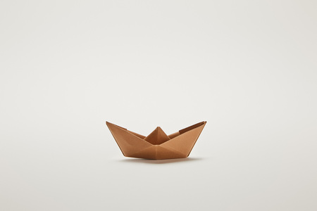 paper boat on grey background with copy spaceの写真素材
