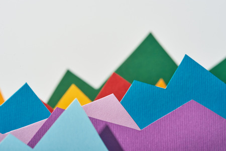 selective focus of multicolored paper graphs with copy space on white background