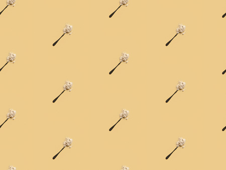 scattered flour in spoons on yellow background, seamless pattern