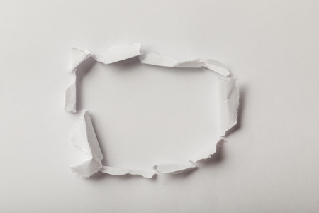 top view of ripped sheets of paper on white backgroundの写真素材
