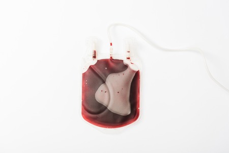 Top view of drip with blood isolated on white, blood donation conceptの写真素材