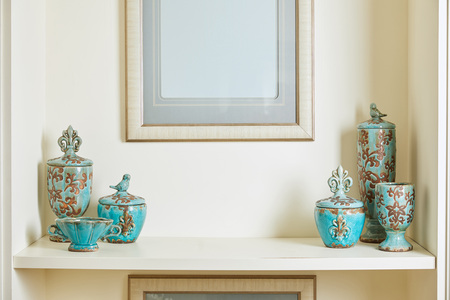 picture frame and turquoise set on surfaceの写真素材