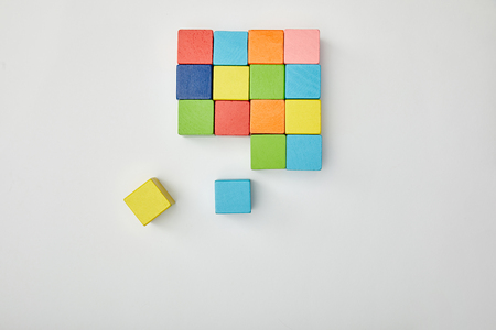 top view of multicolored blocks on grey background