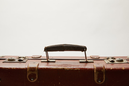 lather brown suitcase with copy space isolated on greyの写真素材