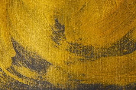 different golden brushstrokes drawn on grey backgroundの写真素材