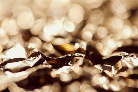 selrctive focus of foil with blurred sparkling lights and twinklesの写真素材