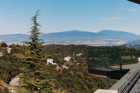 beautiful view of green hill and mountains from balcony, barcelona, spainの写真素材
