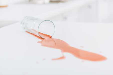 Photo of glass and red stain on white surfaceの写真素材