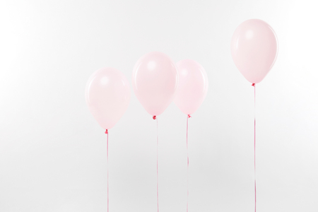decorative pink air balloons on white with copy spaceの写真素材