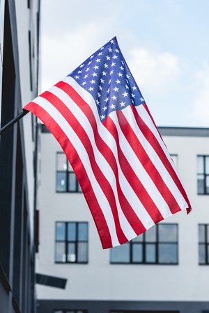stars and stripes on flag of america near buildingの写真素材