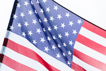 close up of national usa flag with stars and stripes isolated on whiteの写真素材