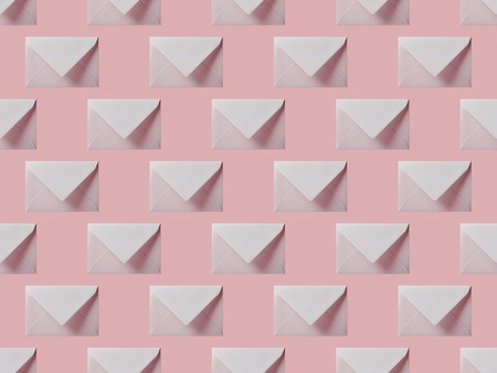 top view of flat lay with white envelopes isolated on pinkの写真素材