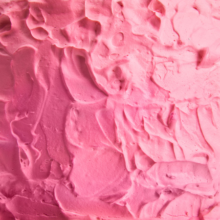 close up of pink cream on tasty baked cakeの写真素材