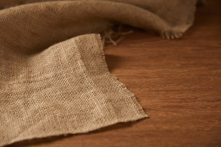 background with sackcloth on wooden surface with copy spaceの写真素材