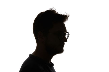 Silhouette of man in glasses with beard isolated on whiteの写真素材