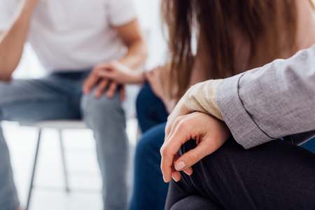 cropped view of hands of woman during group therapy session with copy spaceの写真素材
