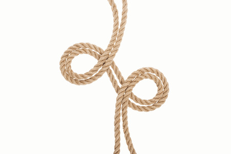 curled brown and jute ropes isolated on whiteの写真素材