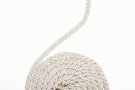 white and twisted rope isolated on whiteの写真素材