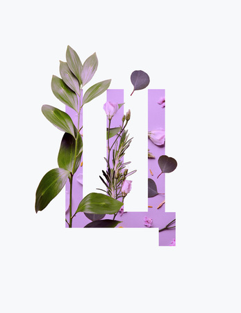 Cyrillic letter with green leaves on light purple background isolated on whiteの写真素材