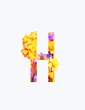 Cyrillic letter with yellow and purple flowers isolated on white backgroundの写真素材