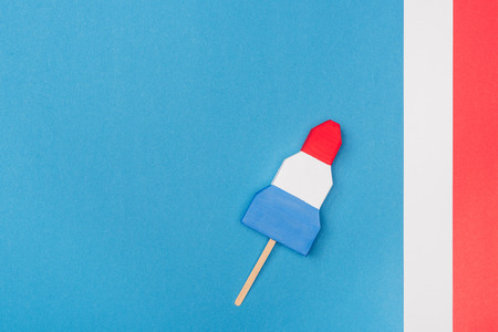 top view of f handmade paper ice cream on blue with stripes and copy spaceの写真素材