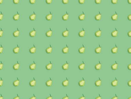 Top view of seamless pattern with handmade paper pears isolated on green background