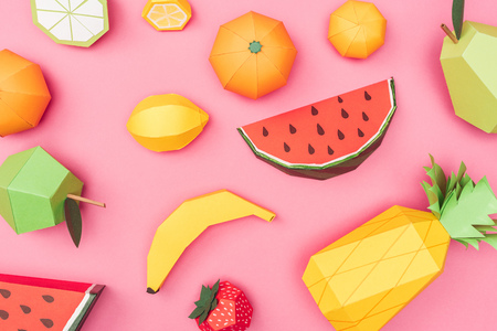 Top view of handmade colorful origami fruits on pink backgroundの写真素材