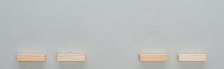 Panoramic shot of wooden blocks isolated on grey with copy space