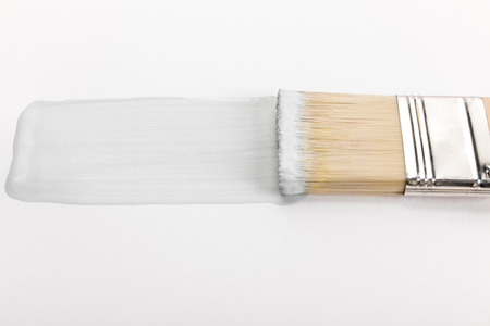 Close up view of brush and brushstroke isolated on white background