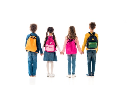 Back view of schoolchildren with backpacks holding hands isolated on white backgroundの写真素材