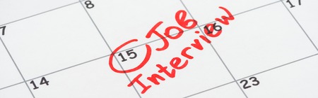 Panoramic shot of print calendar with red mark and job interview wordsの写真素材